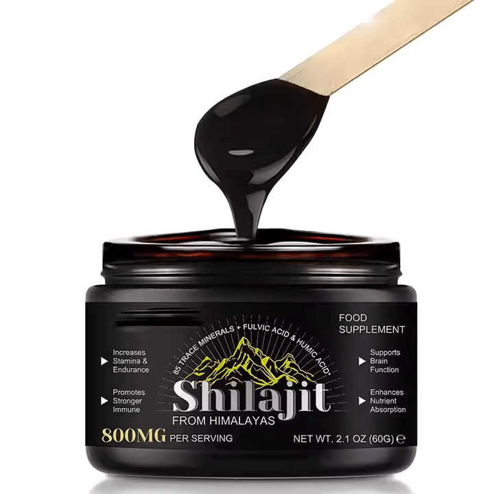 Shilajit pure resin in a jar with spoon, natural energy supplement from Himalayas, rich in fulvic acid and minerals.
