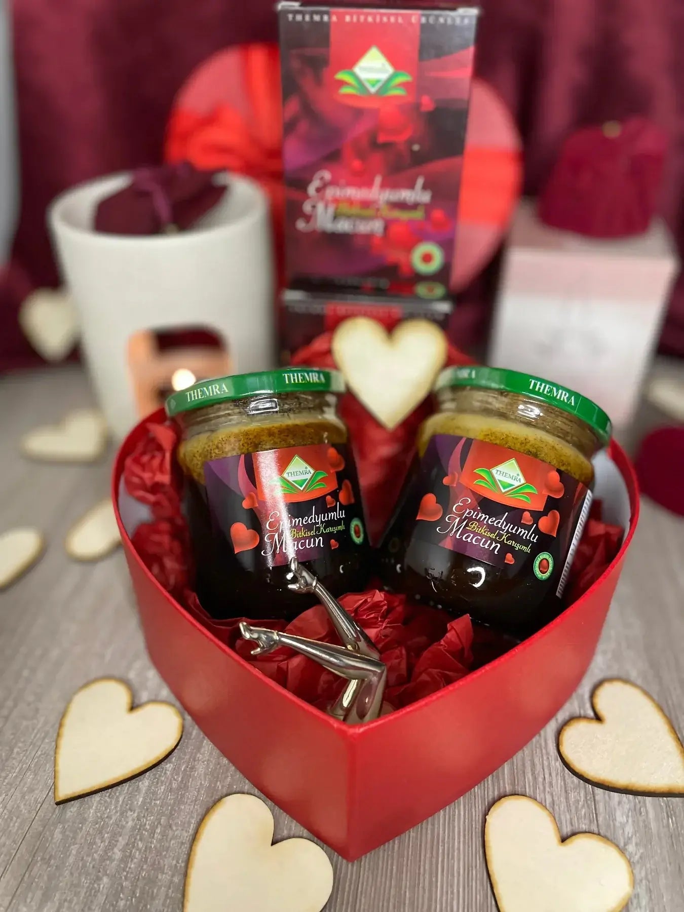 Heart-shaped gift box featuring Themra Epimedium Macun jars, surrounded by decorative hearts and love-themed elements.