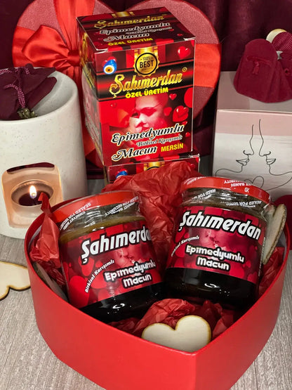 Sahmerdan Epimedyumlu Macun jars in a heart-shaped box, showcasing natural health benefits with honey and herbs.